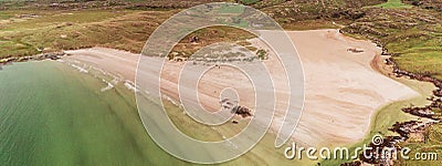 Panorama image of Silver Strand beach in county Mayo, Aerial drone view. Atlantic ocean water rushing towards sand. Nobody Stock Photo