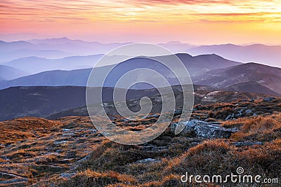 Panorama with interesting sunrise enlightens surroundings. Landscape with beautiful mountains and stones. Fantastic autumn scenery Stock Photo