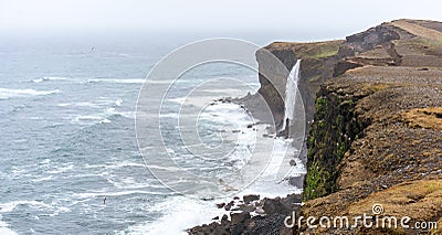 Panorama of KetubjÃ¶rg bird cliffs and waterfall in the Skagi peninsula in Iceland. Stock Photo