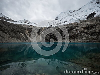 Panorama landscape view of andean alpine mountain lake Laguna 69 Cordillera Blanca Cebollapampa Huaraz Ancash Peru Stock Photo