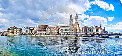 Limmat river with Munsterbrucke bridge and Grossmunster with houses on the river's bank, Zurich, Switzerland Stock Photo