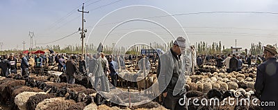 Panorama of men bartering over sheep, Kashgar Sunday Livestock M Editorial Stock Photo