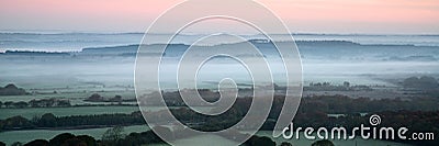 Panorama misty countryside landscape vibrant dawn sunrise Stock Photo