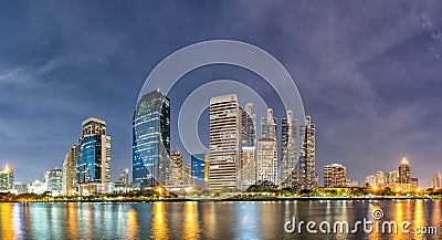 Panorama,Modern buildings and business district cityscape from urban park,night view,cityscape image of Benchakitti Park,Bangkok, Stock Photo