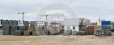 Panorama of a modern standard construction site in a small European city. Stock Photo