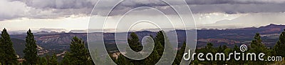 Panorama, morning thunderstorms over desert mountains Stock Photo