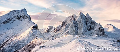 Panorama of Mountaineer standing on top of snowy mountain range Stock Photo