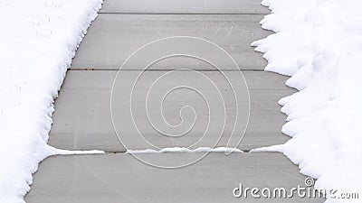 Panorama Narrow walkway on ground covered with fresh white snow in winter season Stock Photo
