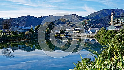 Panorama of Nelson City, reflected in the Maitai River, New Zealand Stock Photo