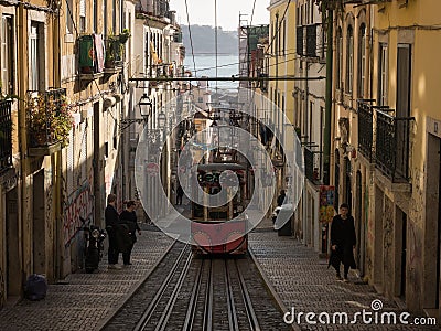 Panorama of old historic yellow street cable car funicular Ascensor da Bica Elevador lift railway tram Lisbon Portugal Editorial Stock Photo