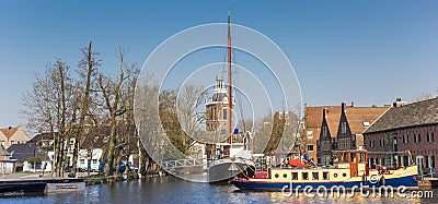 Panorama of old ships and church tower in Meppel Editorial Stock Photo