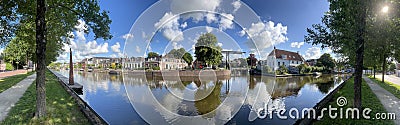 Panorama from a path next to a canal in Sneek Editorial Stock Photo