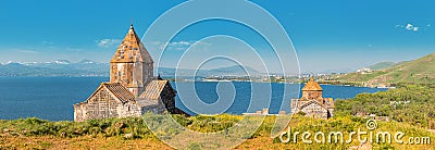 Panorama from peninsula viewpoint to Sevanavank Monastery and chapel overlooking famous Sevan lake at sunny weather Stock Photo