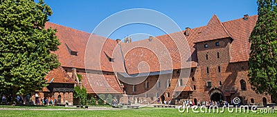 Panorama of people in the courtyard of castle Malbork Editorial Stock Photo