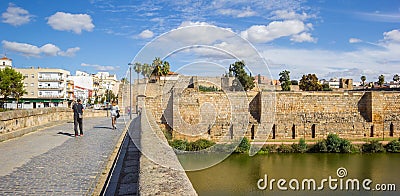 Panorama of people walking the roman bridge in Merida Editorial Stock Photo