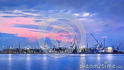 Panorama of a petrochemical production plant against a dramatic colored sky at twilight, Port of Antwerp, Belgium. Stock Photo