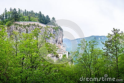 Panorama Place of pilgrimage Madonna della Corona with church on the hill above the Adige. Stock Photo