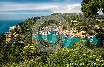 Panorama of Portofino town with multicolored houses and villas, sea and harbor bay with fishing boats and luxury yachts Stock Photo