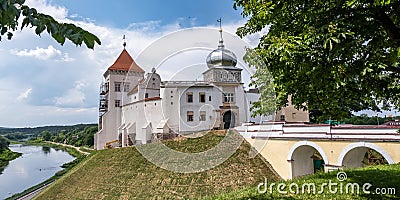 Panorama promenade overlooking the old city and historic buildings of medieval castle near bridge and wide river Stock Photo