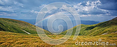 Panoramic picture of the rainbow on the slopes of Goverly Stock Photo