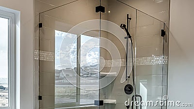 Panorama Rectangular walk in shower stall with half glass enclosure and black shower head Stock Photo