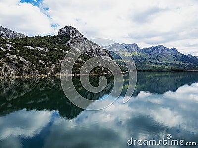 Panorama reflection of Embalse de Gorg Blau artificial lake freshwater reservoir Mallorca Balearic Islands Spain Europe Stock Photo