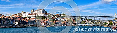 Panorama of the riverbank of Ribeira District and Dom Luis I Bridge in Porto, Portugal Editorial Stock Photo
