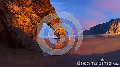 Panorama of rocky arch at the Adraga beach Stock Photo
