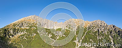 Panorama of rocky mountain range Granaty and Krzyzne pass in Five Polish Ponds Valley in Tatra Mountains, Poland Stock Photo