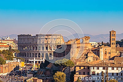 Panorama Rome Italy, sunset city Colosseum ruins Roman Forum from square of Venice Stock Photo