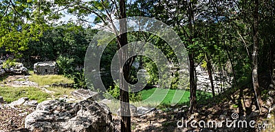 Panorama of Sacrifice Cenote at Chichen Itza ruins. Mayan Culture. Traveling Through Mexico. Stock Photo