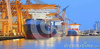 panorama scene of ship yard with heavy crane in beautiful twilight use for import export industry and international world trading Stock Photo