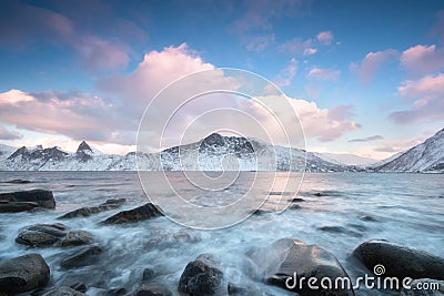 Panorama of snowy fjords and mountain range, Senja, Norway Amazing Norway nature seascape popular tourist attraction. Stock Photo