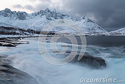 Panorama of snowy fjords and mountain range, Senja, Norway Amazing Norway nature seascape popular tourist attraction. Stock Photo