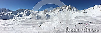 Panorama of snowy mountain peaks and ski slopes at Tignes, ski resort in the Alps France Stock Photo