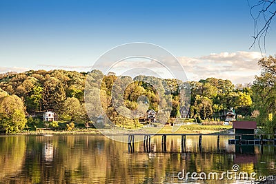 Panorama of Sotsko Jezero, or lake Sot, in Fruska Gora, in Serbia, Europe, in summer, at dusk, into the light with cabins Stock Photo