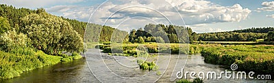 Panorama of the summer landscape on the banks of the Ural river with forest, Russia Stock Photo