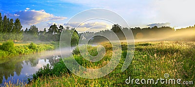 Panorama of a summer landscape with sunrise, fog and the river Stock Photo
