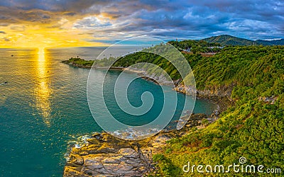 Panorama sunset above Promthep cape is a mountain of rock that extends into the sea in Phuket Thailand. Stock Photo