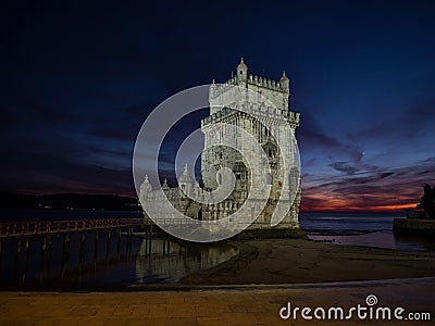 Panorama sunset view of medieval historic defense fortification bastion Torre Belem Tower in Tagus river Lisbon Portugal Stock Photo