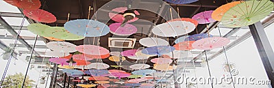 Panorama view colorful umbrellas ceiling display decoration on upscale riverside restaurant in Saigon Ho Chi Minh City, Vietnam, Editorial Stock Photo