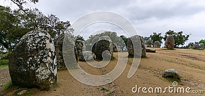 Panorama view of the Cromlech of the Almendres megalithic complex in the Alentejo region of Portugal Editorial Stock Photo