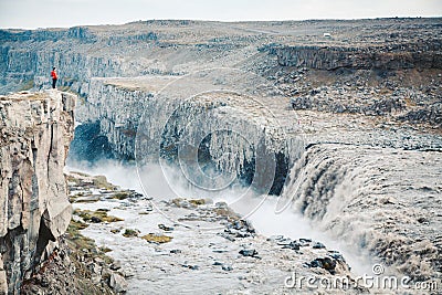 Hiker at gigantic Dettifoss waterfall in Iceland Stock Photo