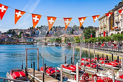 Panorama view of the lake Lugano, mountains and city Lugano, Ticino canton, Switzerland. Scenic beautiful Swiss town with luxury Editorial Stock Photo