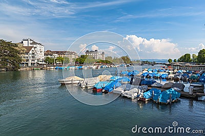 Panorama view of Limmat river towards Limmatquai and Zurich old town, with Quay Bridge Quaibruecke, Zurich lake, Swiss Alps Stock Photo