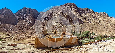 A panorama view of Mount Sinai with Saint Catherine`s Monastery at the foot of the mountain in Egypt Stock Photo