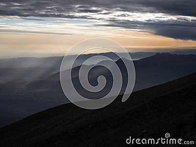 Panorama view of mountain range silhouette layers haze dust fog clouds at Misti volcano Arequipa Peru Andes Stock Photo