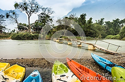 Kayaking on Nam Song river in Vang Vieng, Laos - Rainy Day Stock Photo