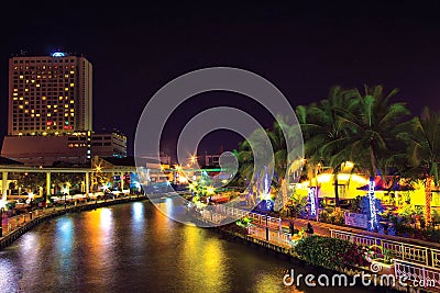 Panorama View of night near river of Melaka river with wheel and bridge. Stock Photo
