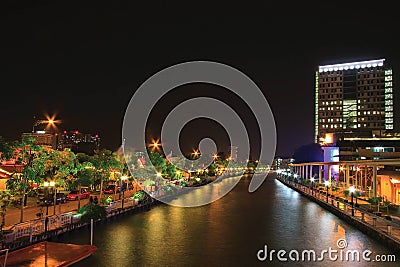 Panorama View of night near river of Melaka river with wheel and bridge. Stock Photo